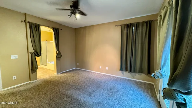 a bathroom with a tub and a shower