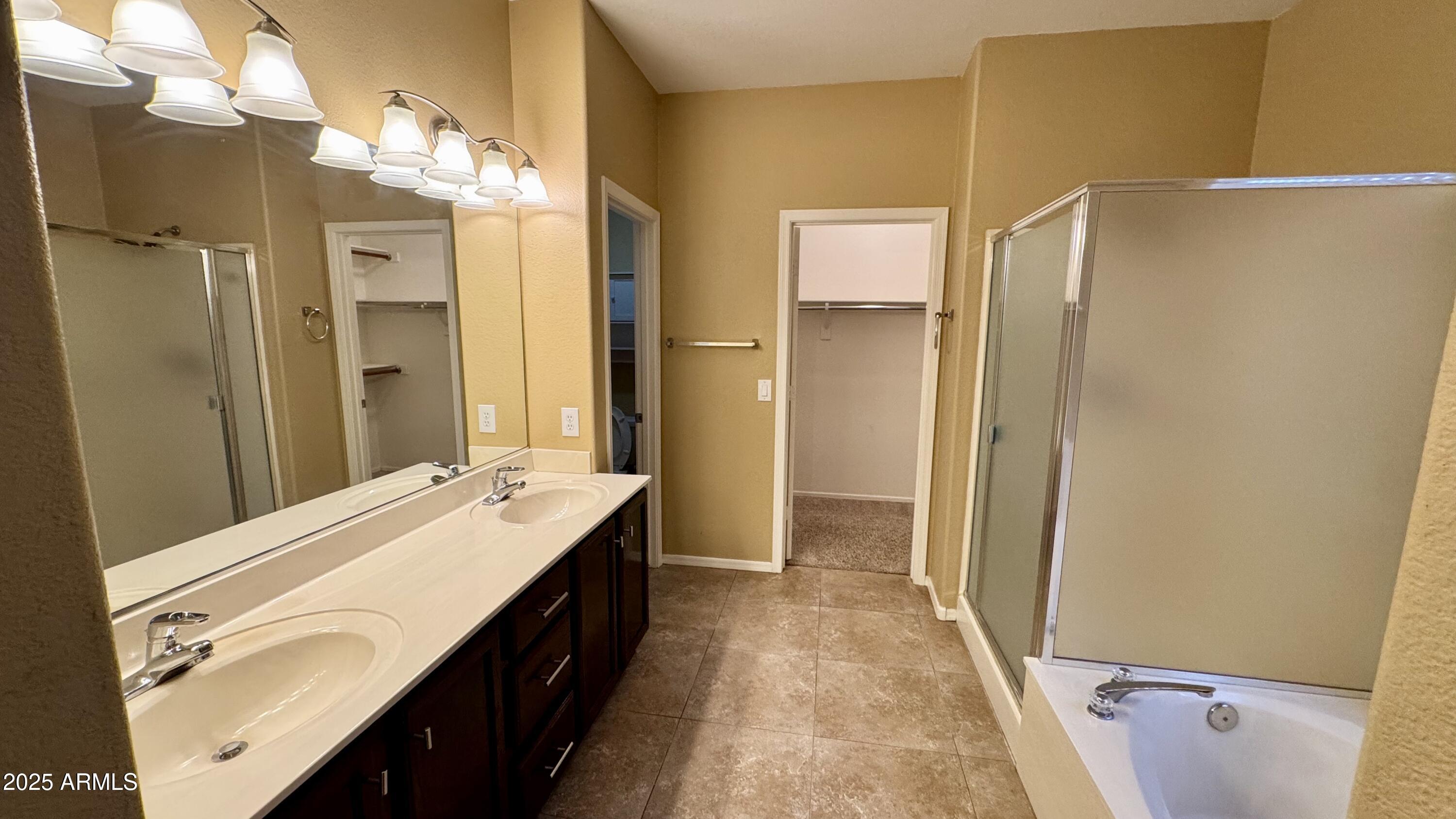 1362 W. Roadrunner Dr. Chandler, AZ 85286 - Photo 18 of 23 a spacious bathroom with a double vanity sink a mirror and a shower
