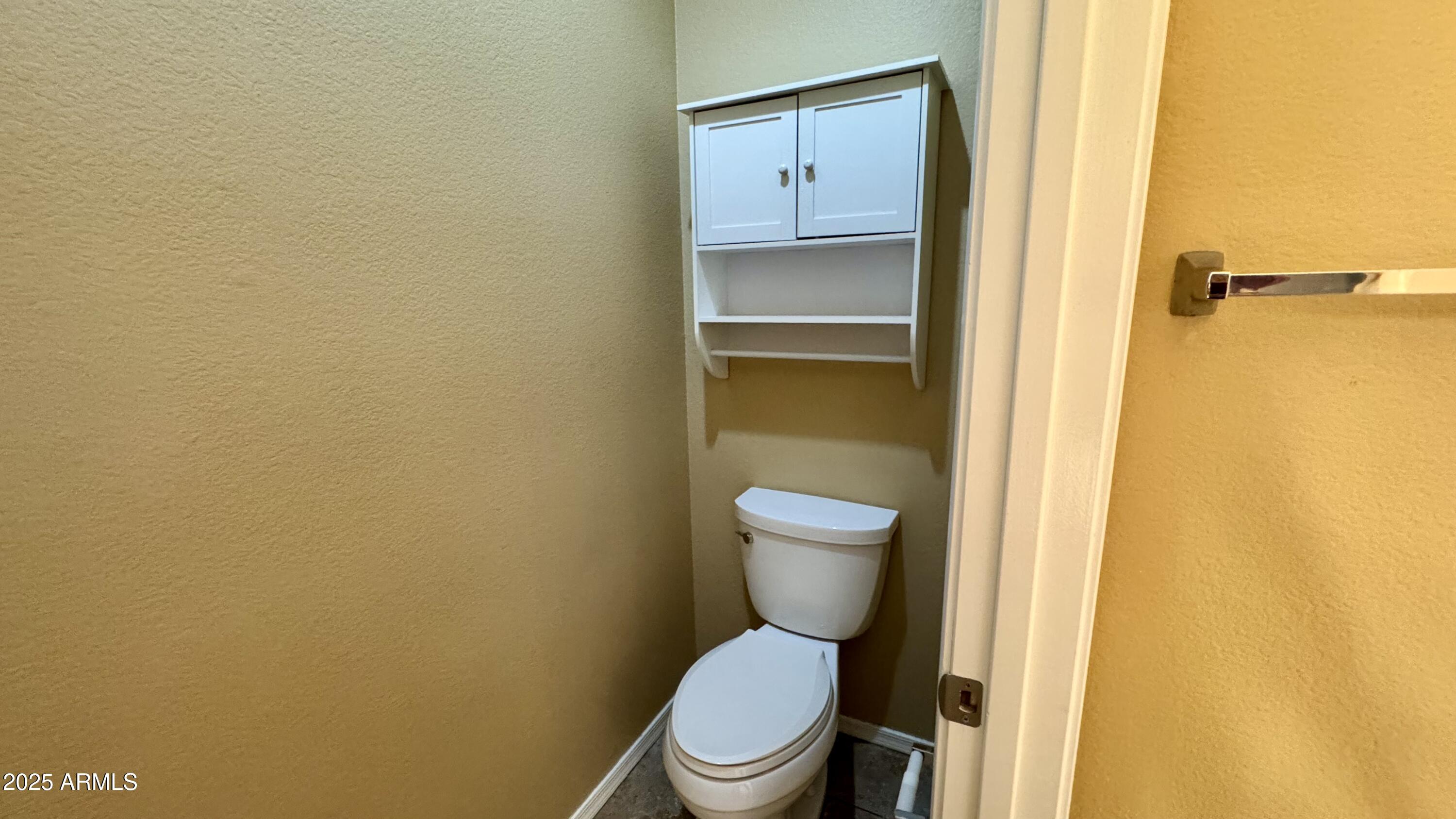 1362 W. Roadrunner Dr. Chandler, AZ 85286 - Photo 19 of 23 a white toilet sitting next to a shower