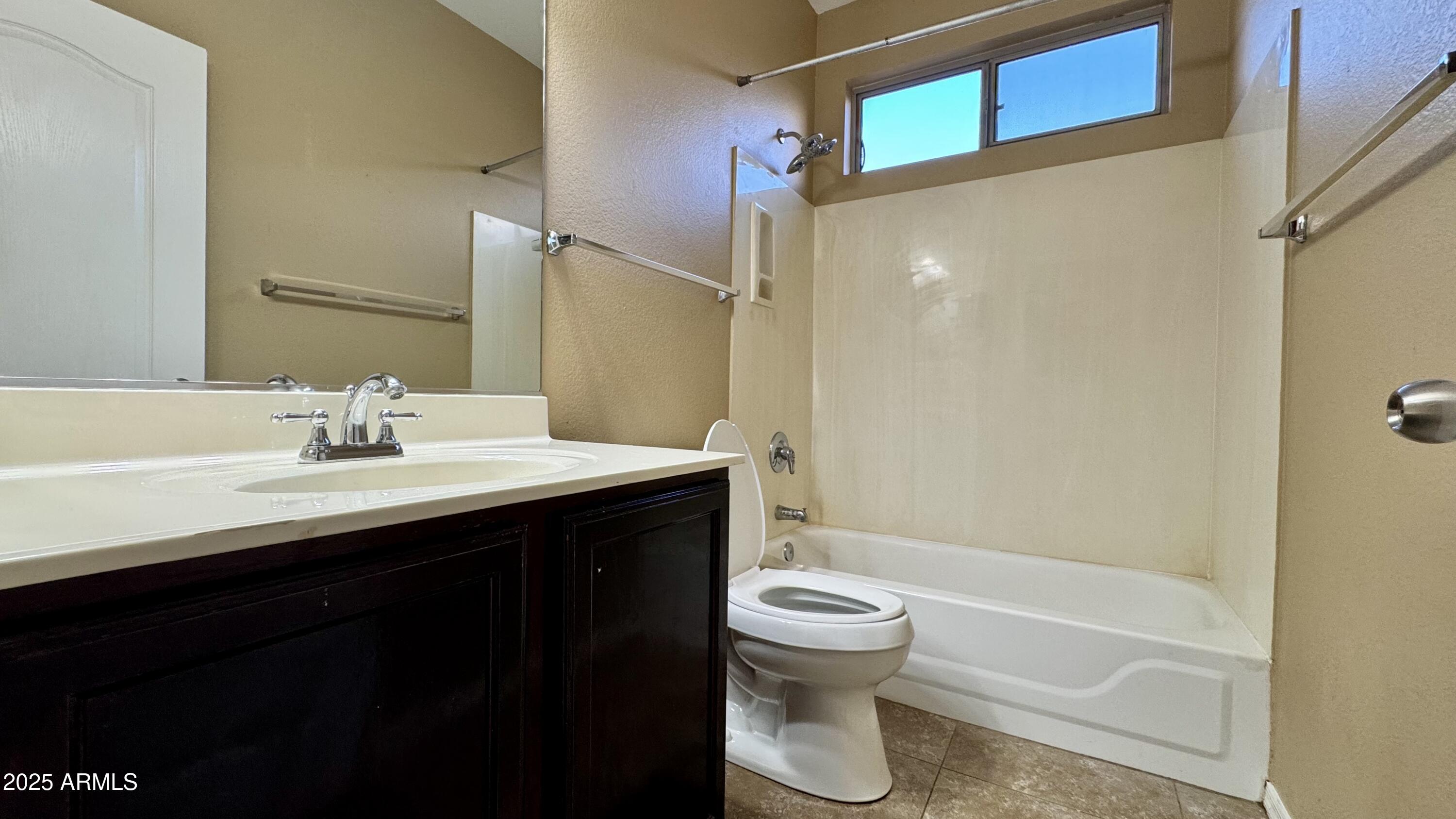 1362 W. Roadrunner Dr. Chandler, AZ 85286 - Photo 7 of 23 a bathroom with a sink toilet and shower
