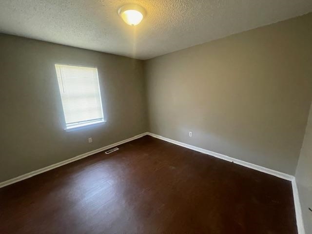 1234 Portersville Road Atoka, TN 38004 - Photo 7 of 11 an empty room with wooden floor and windows