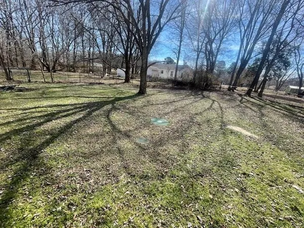 a view of a yard with an trees