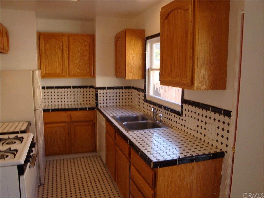 a kitchen with a sink and a stove