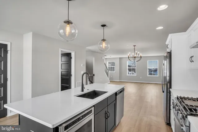 a view of a kitchen from the hallway
