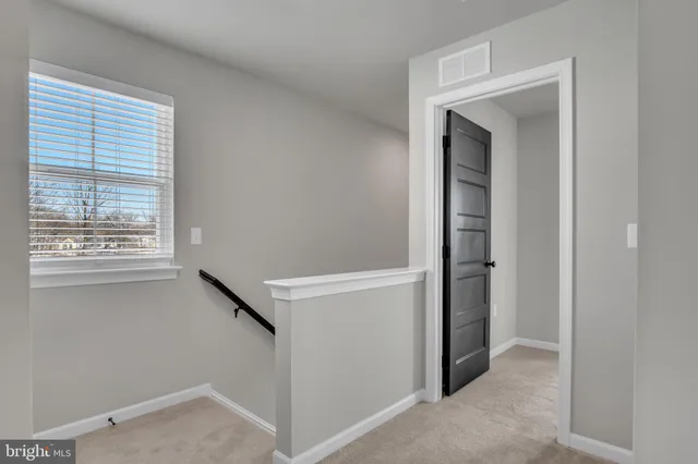 a bathroom with a walk in closet and a shower