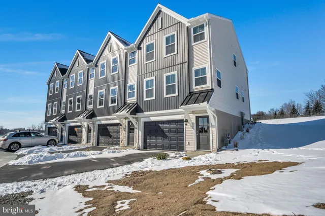 a picture of a bench in front of a wall