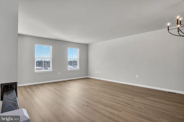 a view of a livingroom with wooden floor
