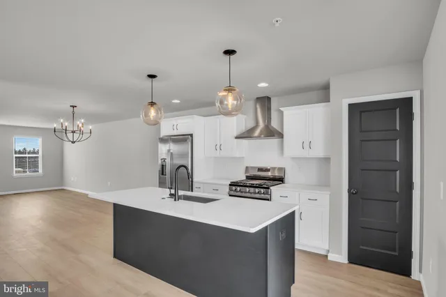 a kitchen with a counter space a sink and appliances