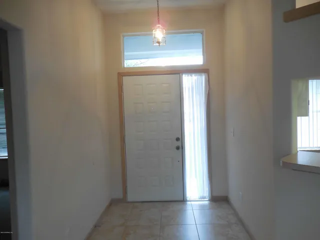 a view of a hallway with windows