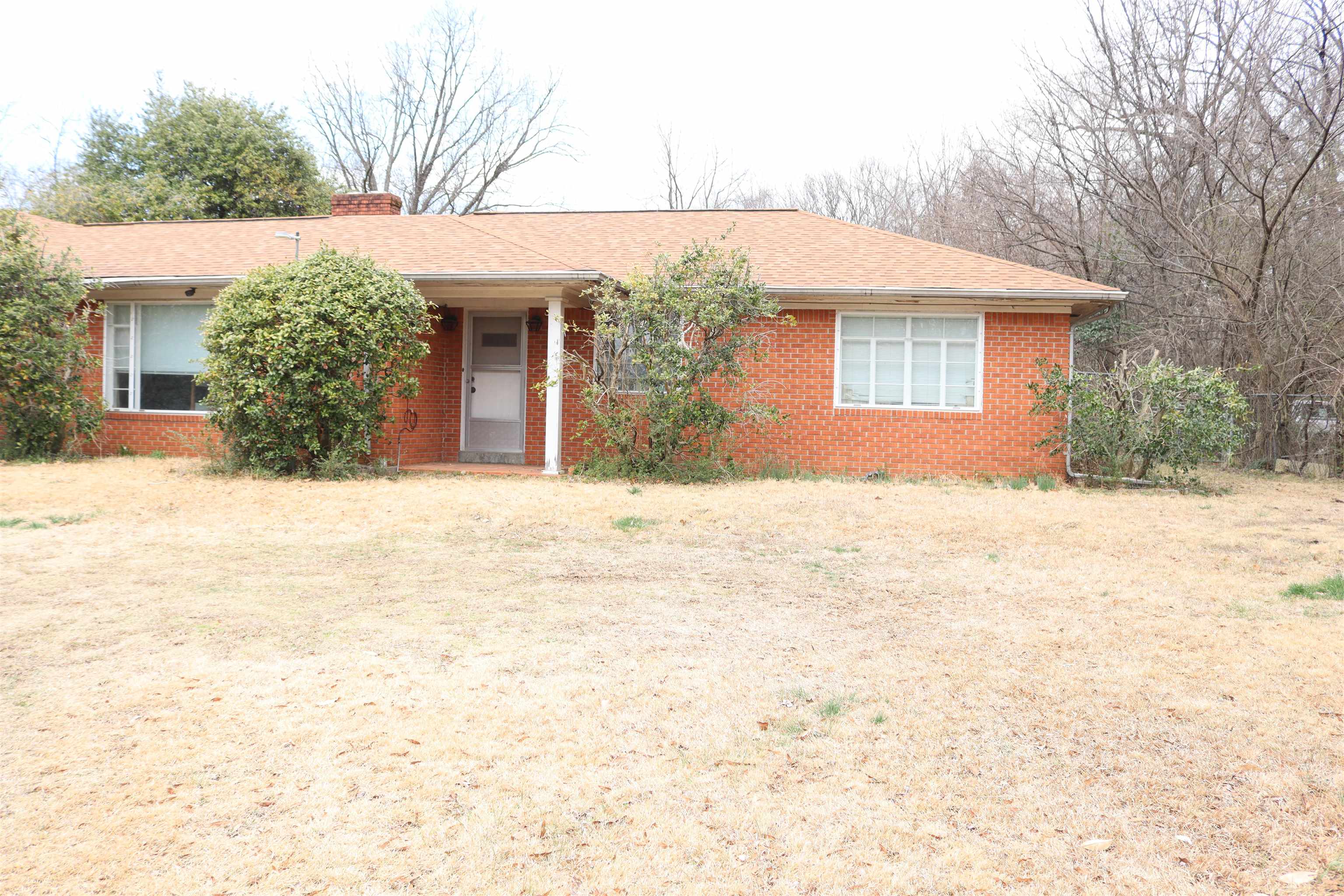 4090 Clearpool Circle Road Memphis, TN 38118 - Photo 2 of 7 Ranch-style home with brick siding, a chimney, and roof with shingles