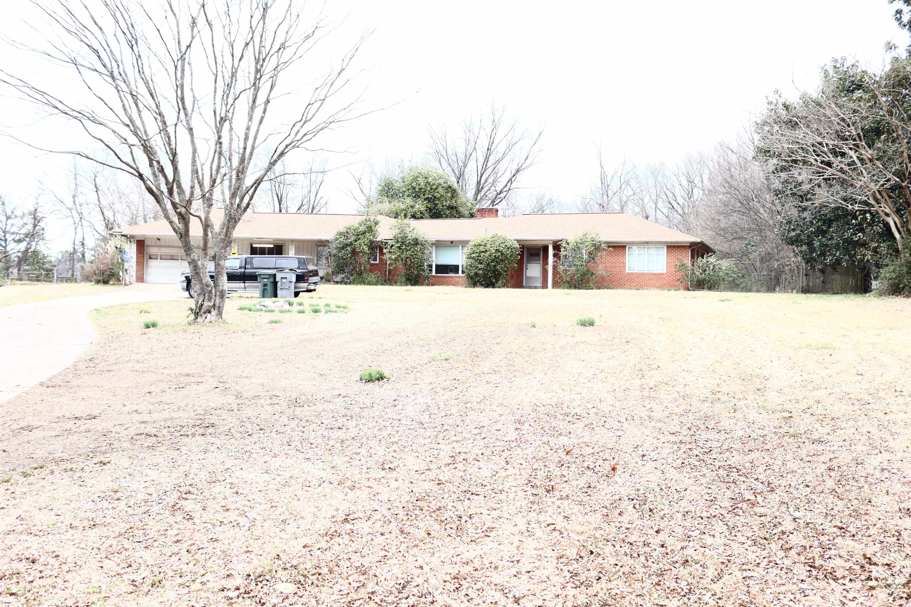 4090 Clearpool Circle Road Memphis, TN 38118 - Photo 3 of 7 Ranch-style home with a chimney and brick siding