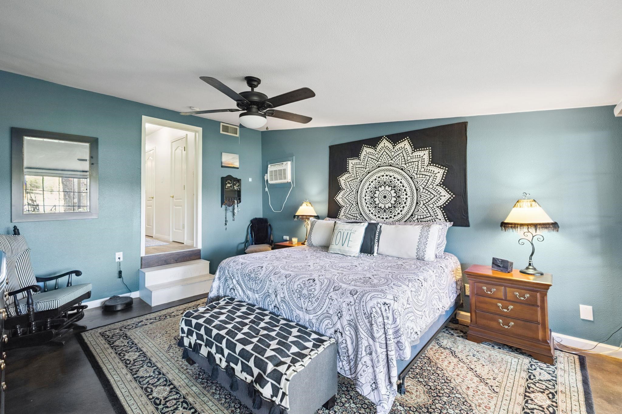 1435 East Zipp Road New Braunfels, TX 78130 - Photo 25 of 43 a bedroom with a bed and a table in it