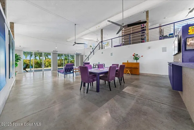 a playing room with furniture and white walls