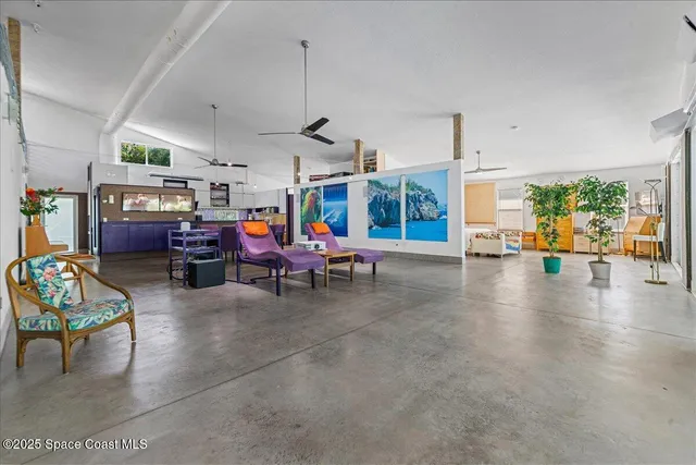 a bedroom with furniture and a potted plant
