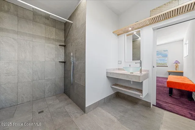 a view of a room with lots of furniture and wooden floor