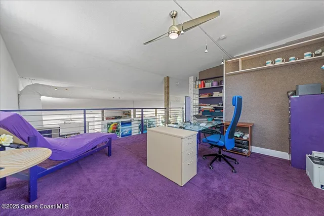 a living room with furniture and a chair