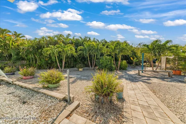 a backyard of a house with lots of green space