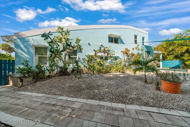 a view of a street with palm trees