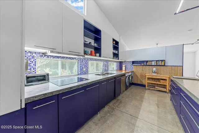 a kitchen with a wooden cabinets and a stove top oven