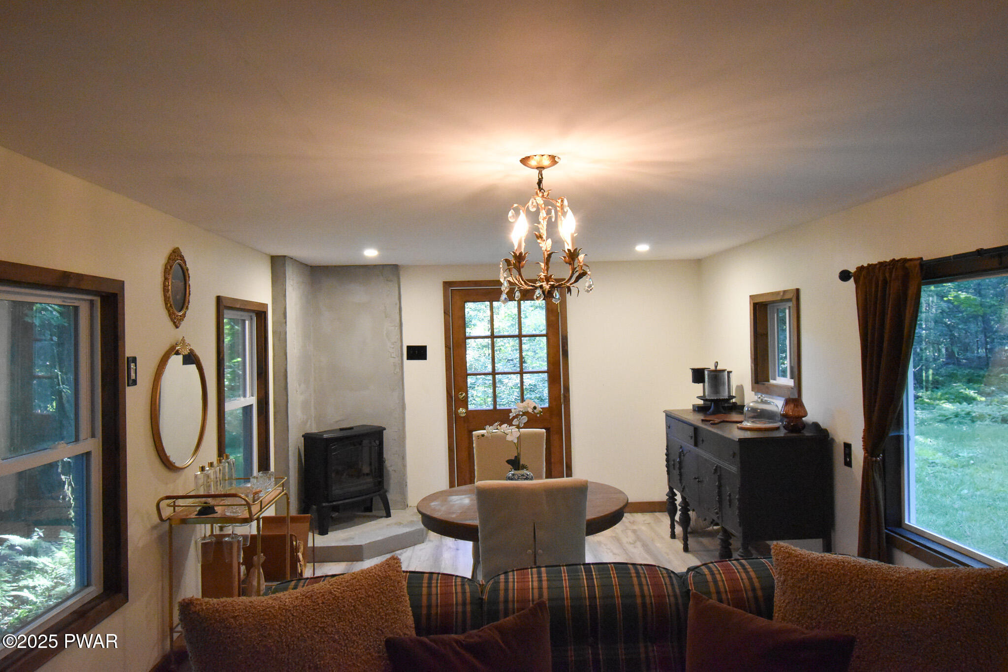 66 Wash Road Waymart, PA 18472 - Photo 41 of 41 a dining room with furniture a fireplace and chandelier