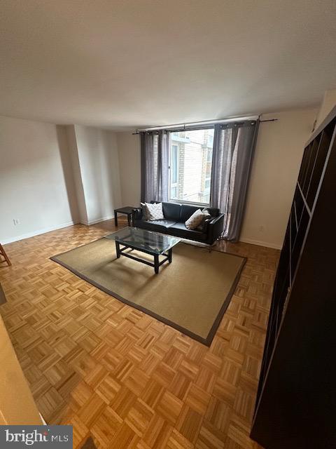 950 25th Street Northwest, Unit 717 Washington, DC 20037 - Photo 3 of 15 a living room with a couch and a table