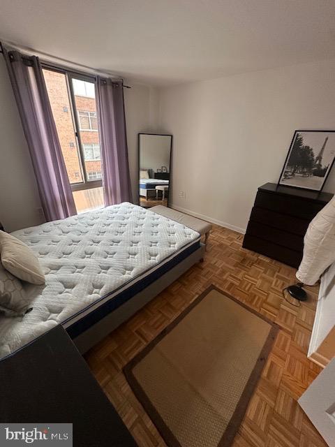 950 25th Street Northwest, Unit 717 Washington, DC 20037 - Photo 10 of 15 a bedroom with a bed and a window