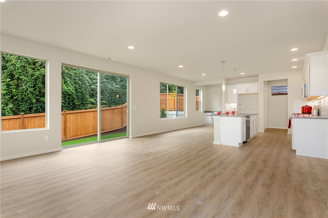 309 Southwest 3rd Court, Unit 9 Renton, WA 98057 - Photo 12 of 25 a view of a kitchen with an empty space and a window