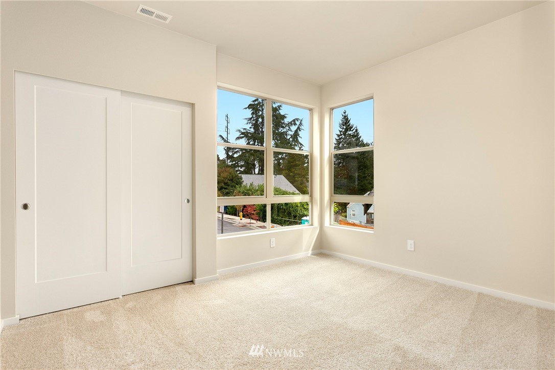 309 Southwest 3rd Court, Unit 9 Renton, WA 98057 - Photo 13 of 25 an empty room with windows