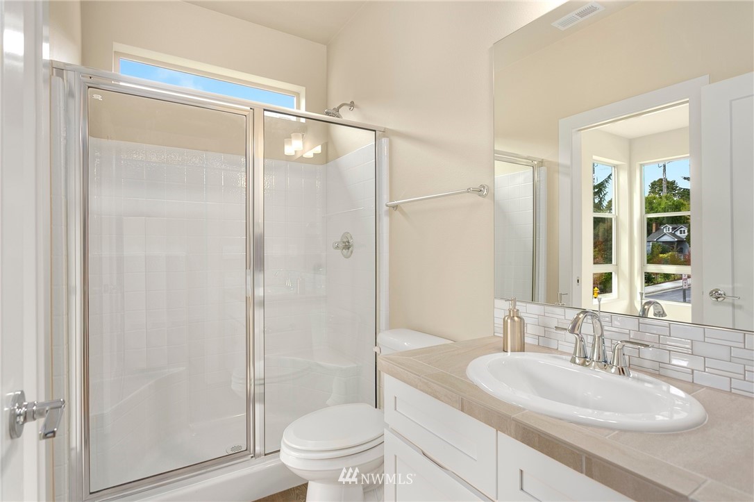 309 Southwest 3rd Court, Unit 9 Renton, WA 98057 - Photo 14 of 25 a bathroom with a sink toilet and shower