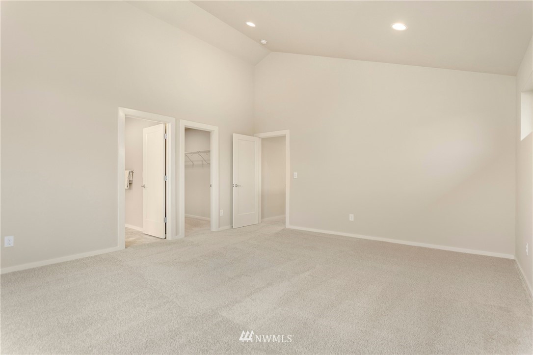 309 Southwest 3rd Court, Unit 9 Renton, WA 98057 - Photo 17 of 25 an empty room with an entryway