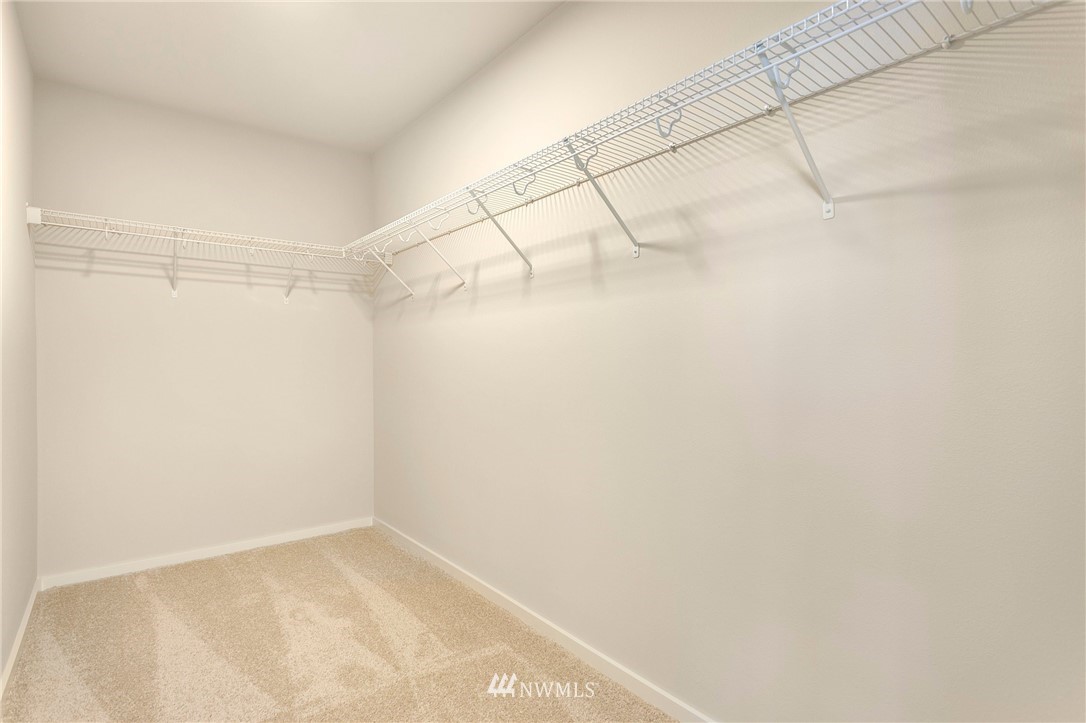 309 Southwest 3rd Court, Unit 9 Renton, WA 98057 - Photo 18 of 25 a view of a room with racks on the wall
