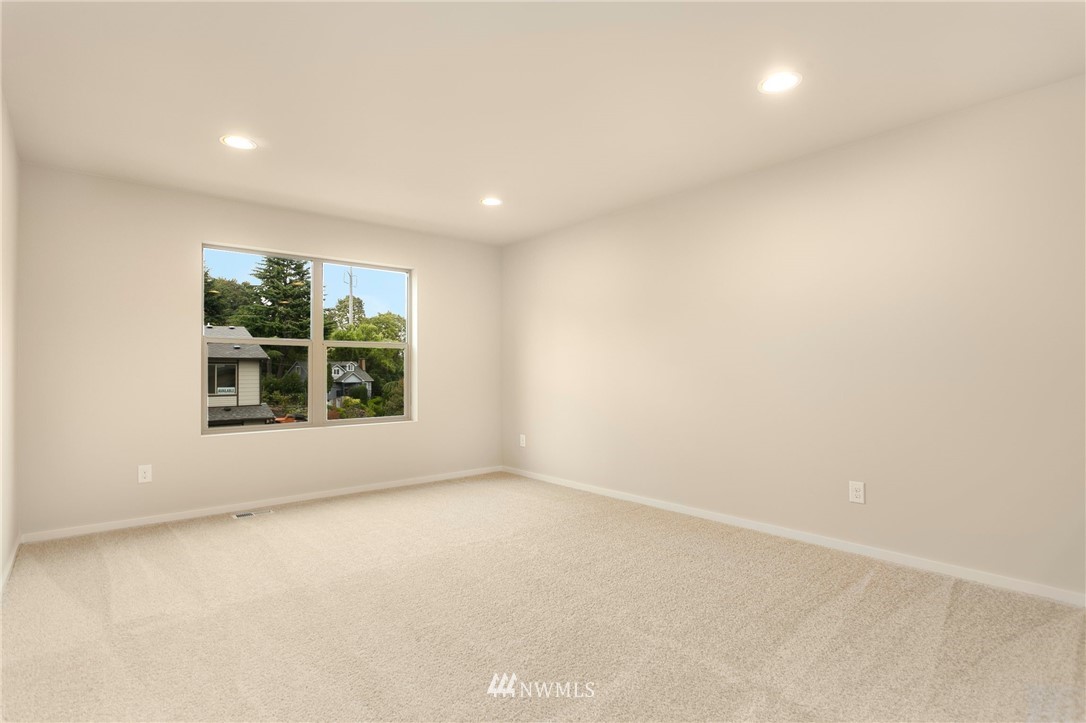 309 Southwest 3rd Court, Unit 9 Renton, WA 98057 - Photo 19 of 25 an empty room with windows