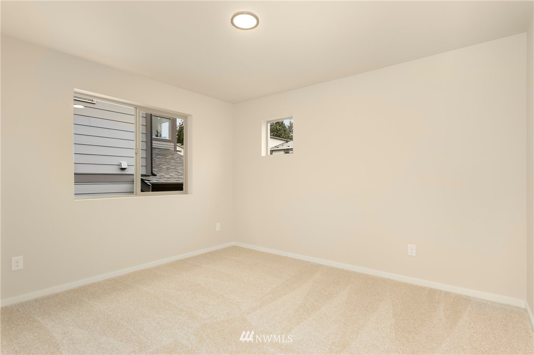 309 Southwest 3rd Court, Unit 9 Renton, WA 98057 - Photo 20 of 25 a view of an empty room with a window