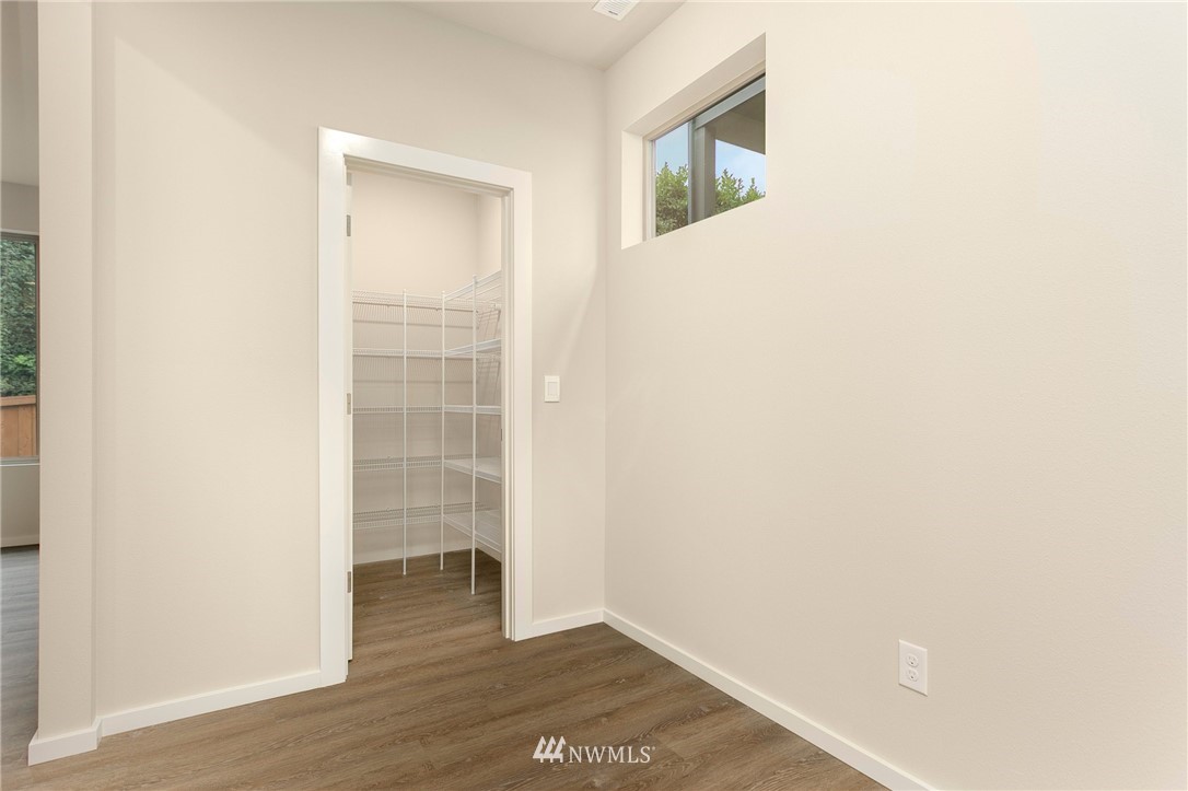 309 Southwest 3rd Court, Unit 9 Renton, WA 98057 - Photo 8 of 25 a view of a room with wooden floor