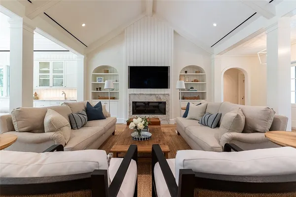 a living room with furniture fireplace and a flat screen tv