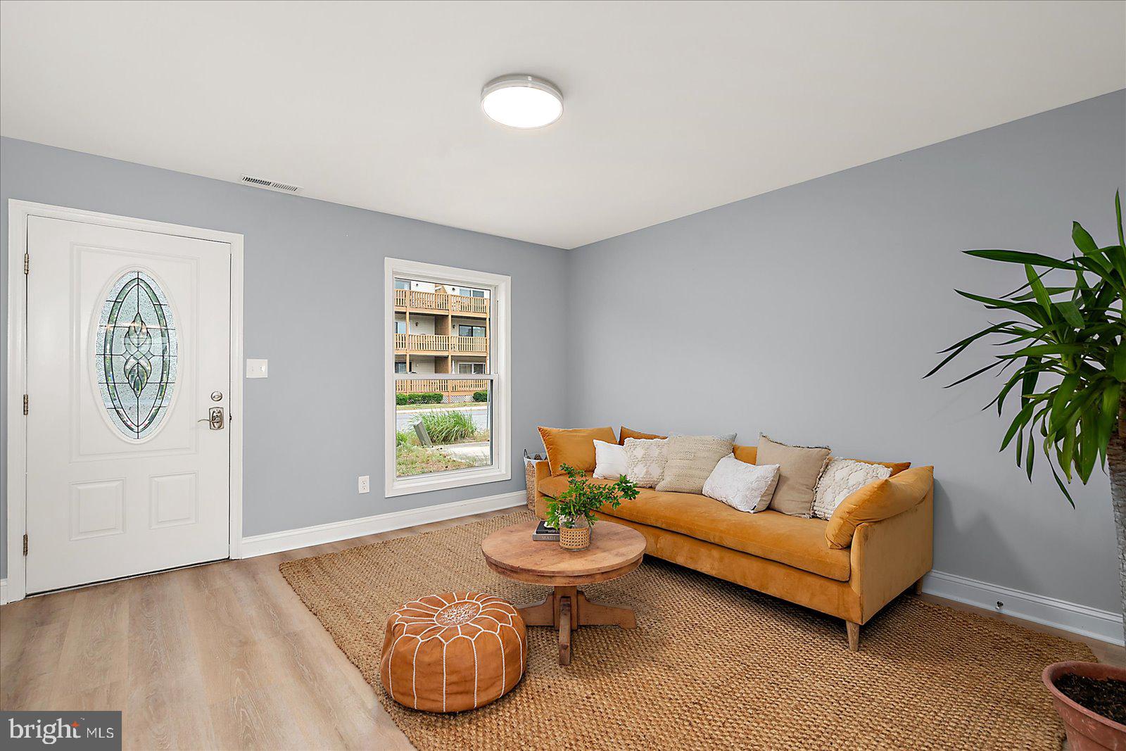 135 Jamestown Road, Unit 18A Ocean City, MD 21842 - Photo 11 of 63 a living room with furniture and a window