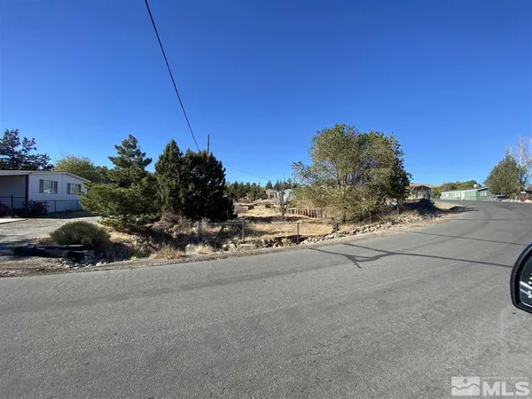 a view of a car park side of a road