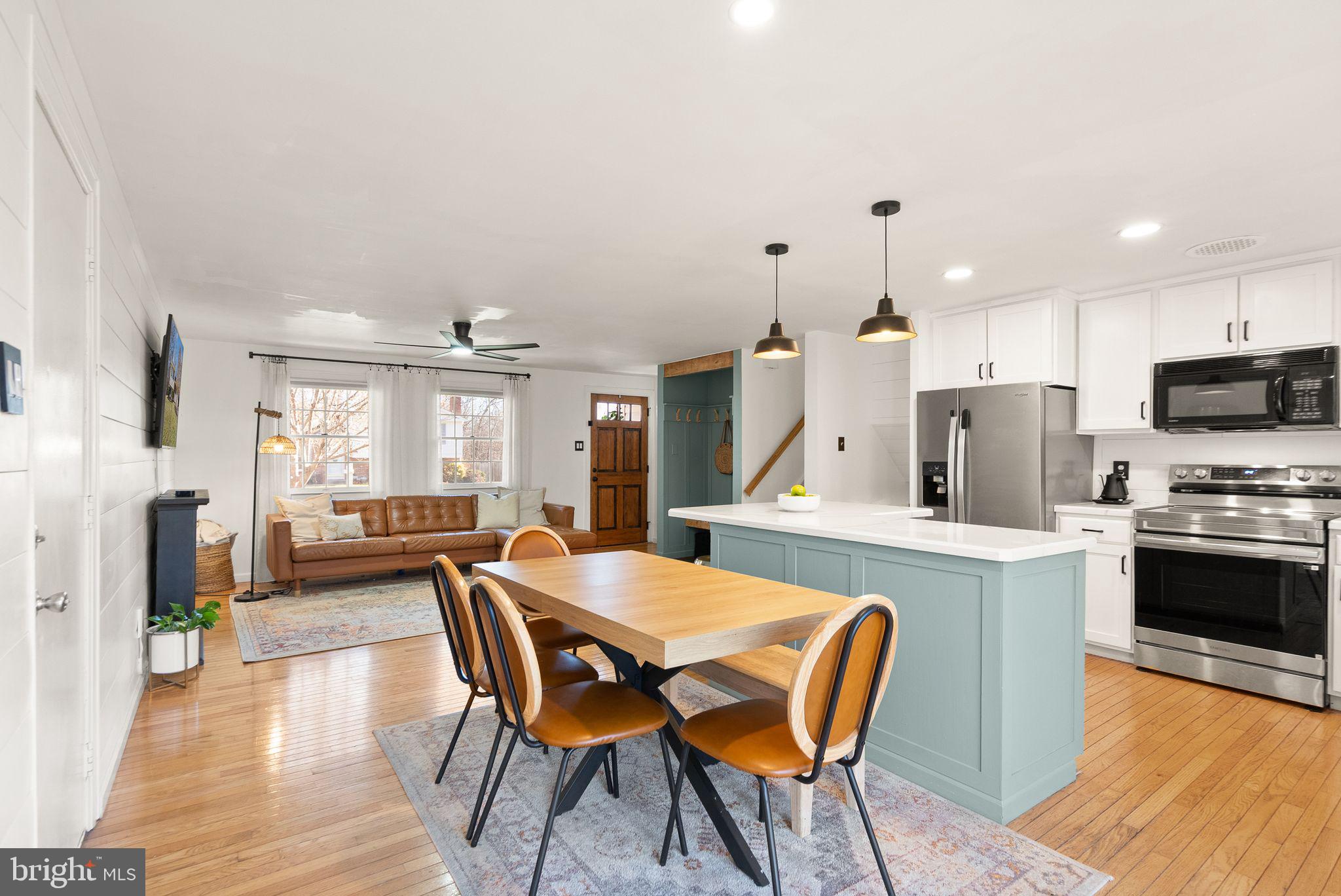 7902 Cliff Rock Court Springfield, VA 22153 - Photo 15 of 57 a view of a dining room with furniture and wooden floor