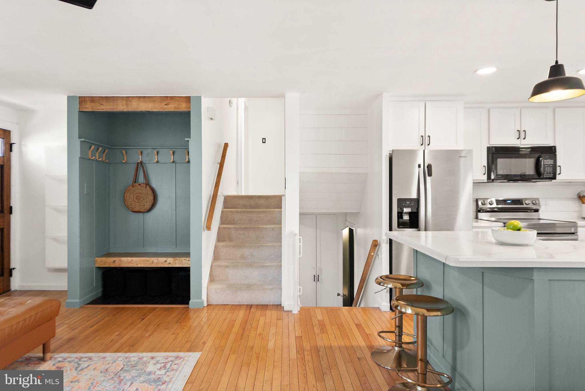 7902 Cliff Rock Court Springfield, VA 22153 - Photo 17 of 57 a kitchen with stainless steel appliances a refrigerator and a stove