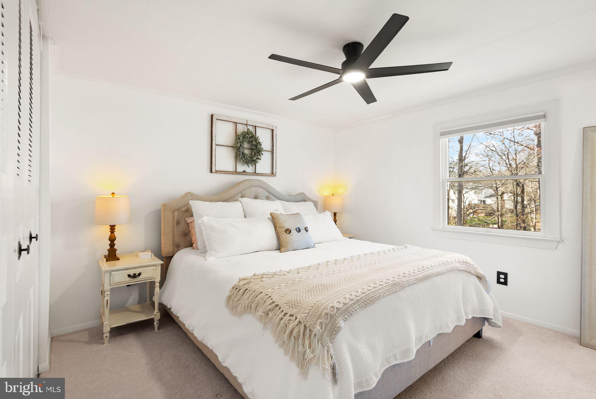 7902 Cliff Rock Court Springfield, VA 22153 - Photo 20 of 57 a bedroom with a bed and a painting on the wall