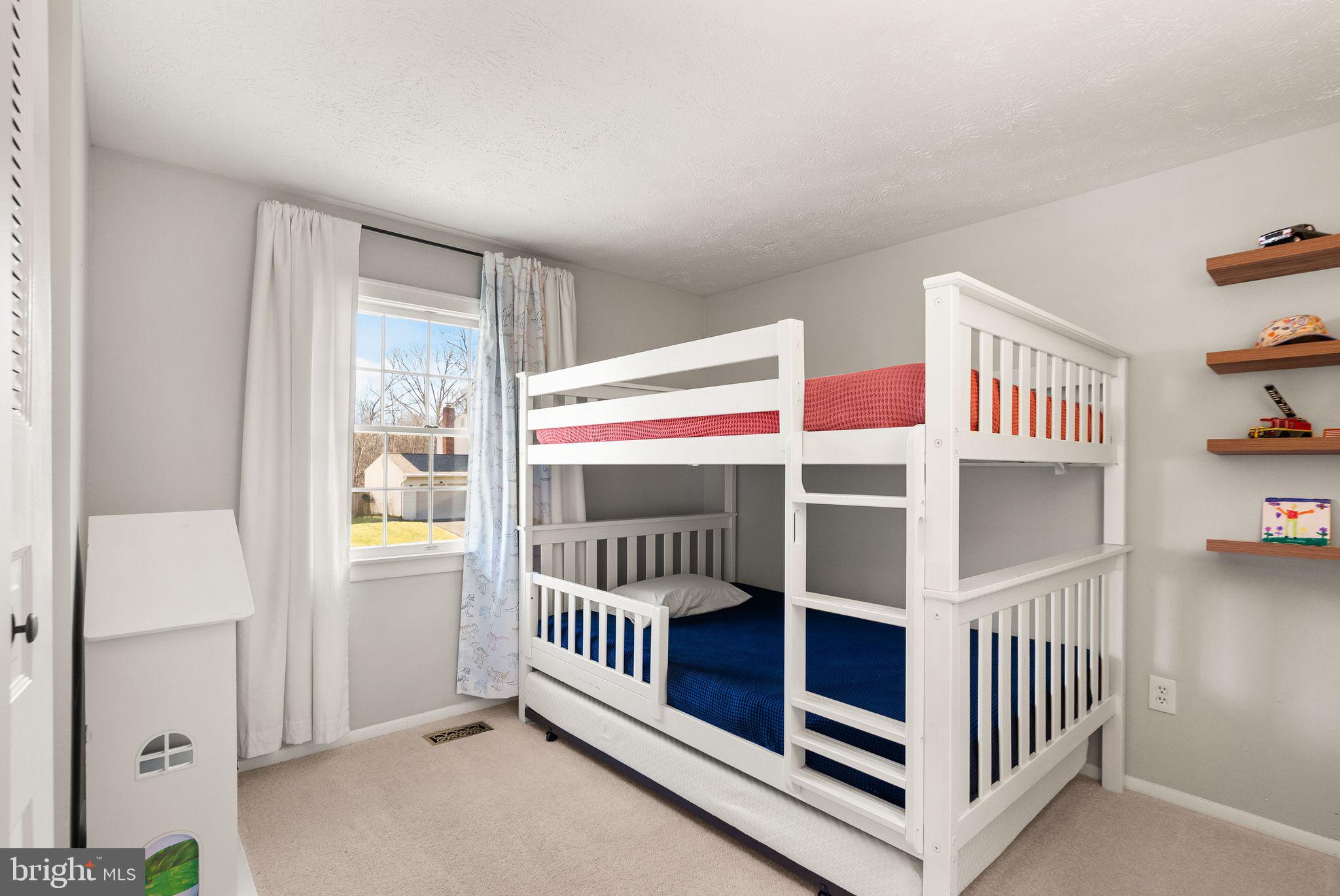 7902 Cliff Rock Court Springfield, VA 22153 - Photo 26 of 57 a view of an empty room with a window