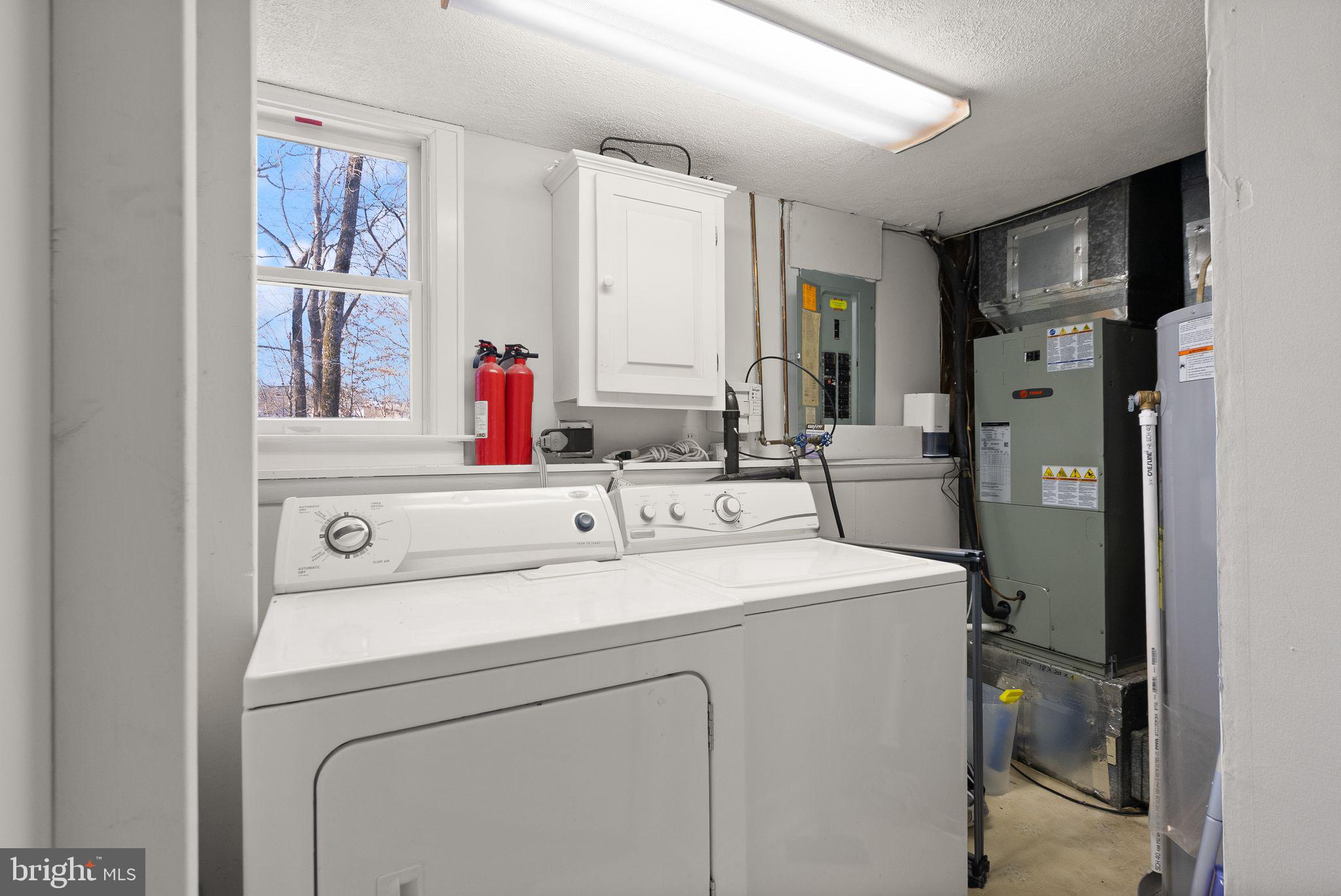 7902 Cliff Rock Court Springfield, VA 22153 - Photo 35 of 57 a utility room with dryer and washer