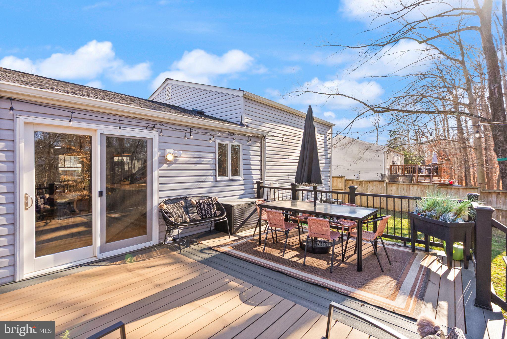7902 Cliff Rock Court Springfield, VA 22153 - Photo 36 of 57 a view of a balcony with two chairs and a table