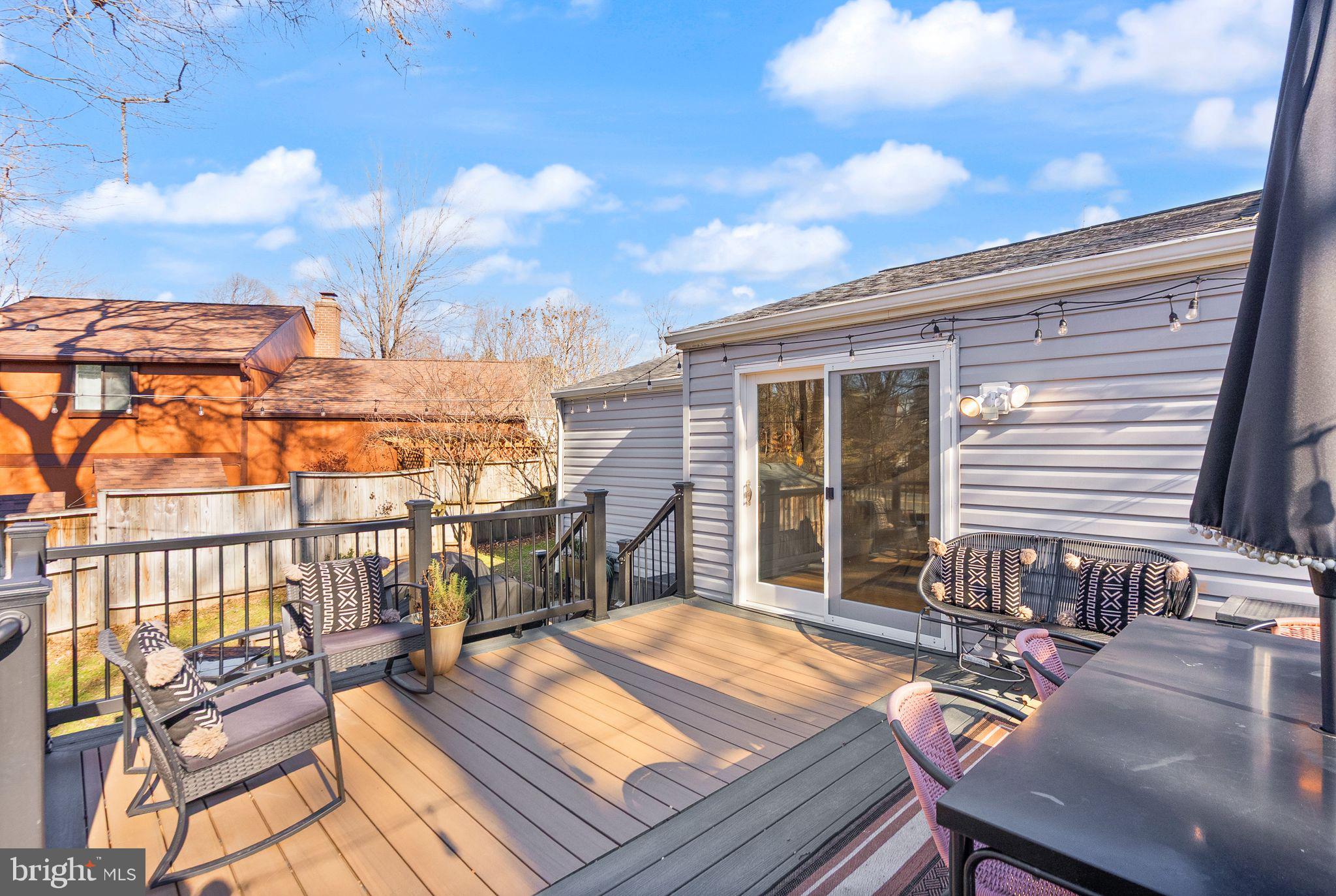 7902 Cliff Rock Court Springfield, VA 22153 - Photo 37 of 57 a balcony with table and chairs
