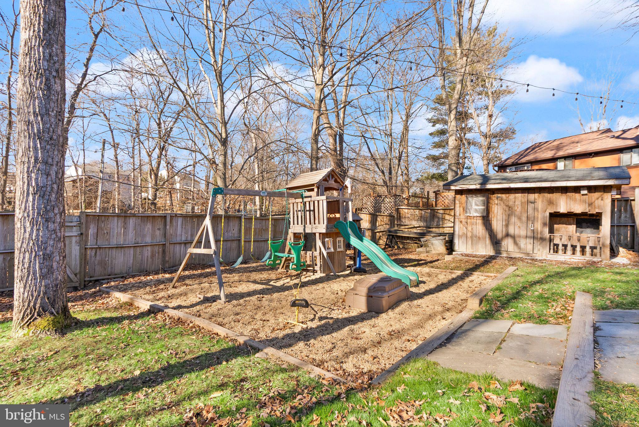 7902 Cliff Rock Court Springfield, VA 22153 - Photo 47 of 57 a view of a backyard with a slide