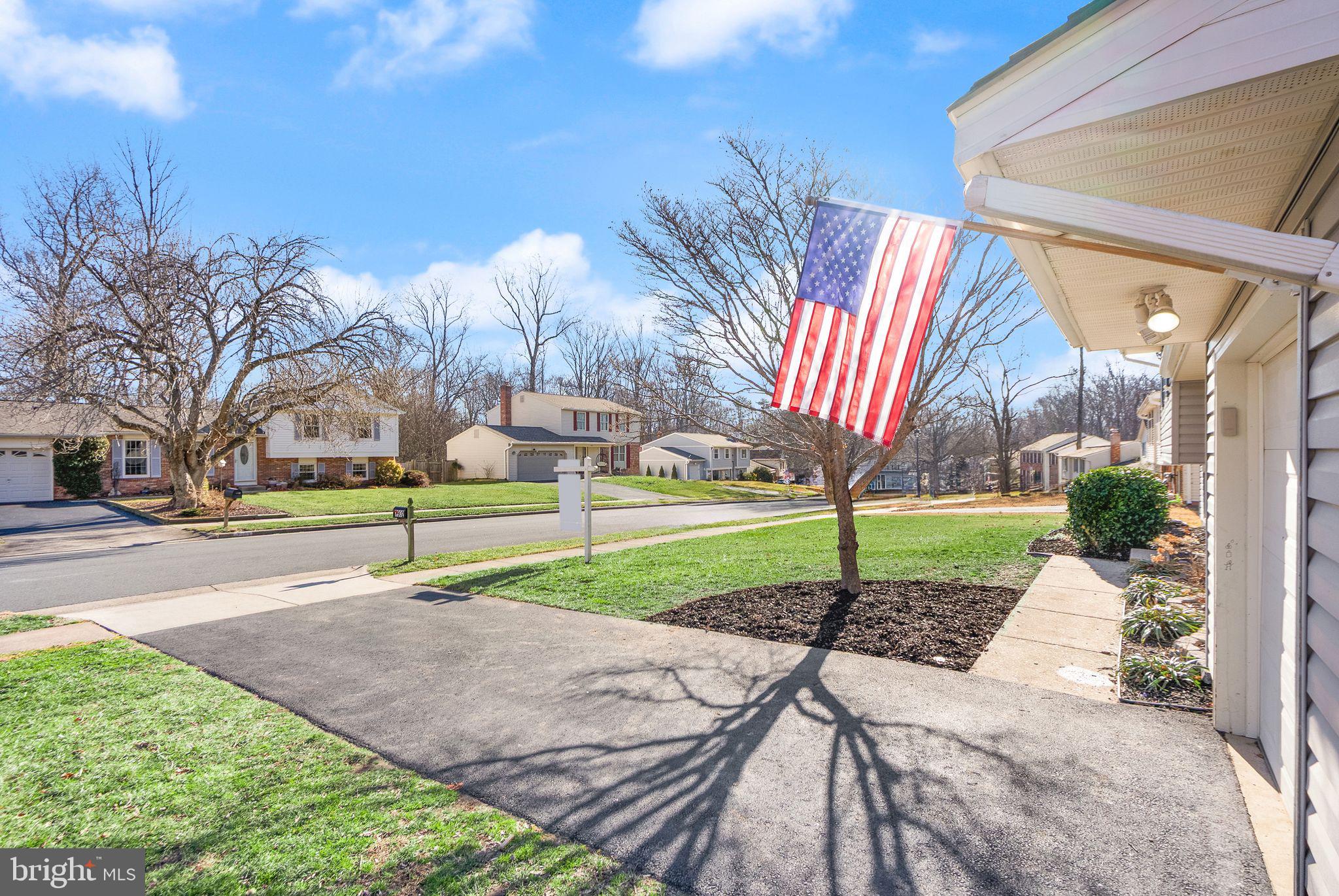 7902 Cliff Rock Court Springfield, VA 22153 - Photo 52 of 57 a view of a house with a big yard and potted plants