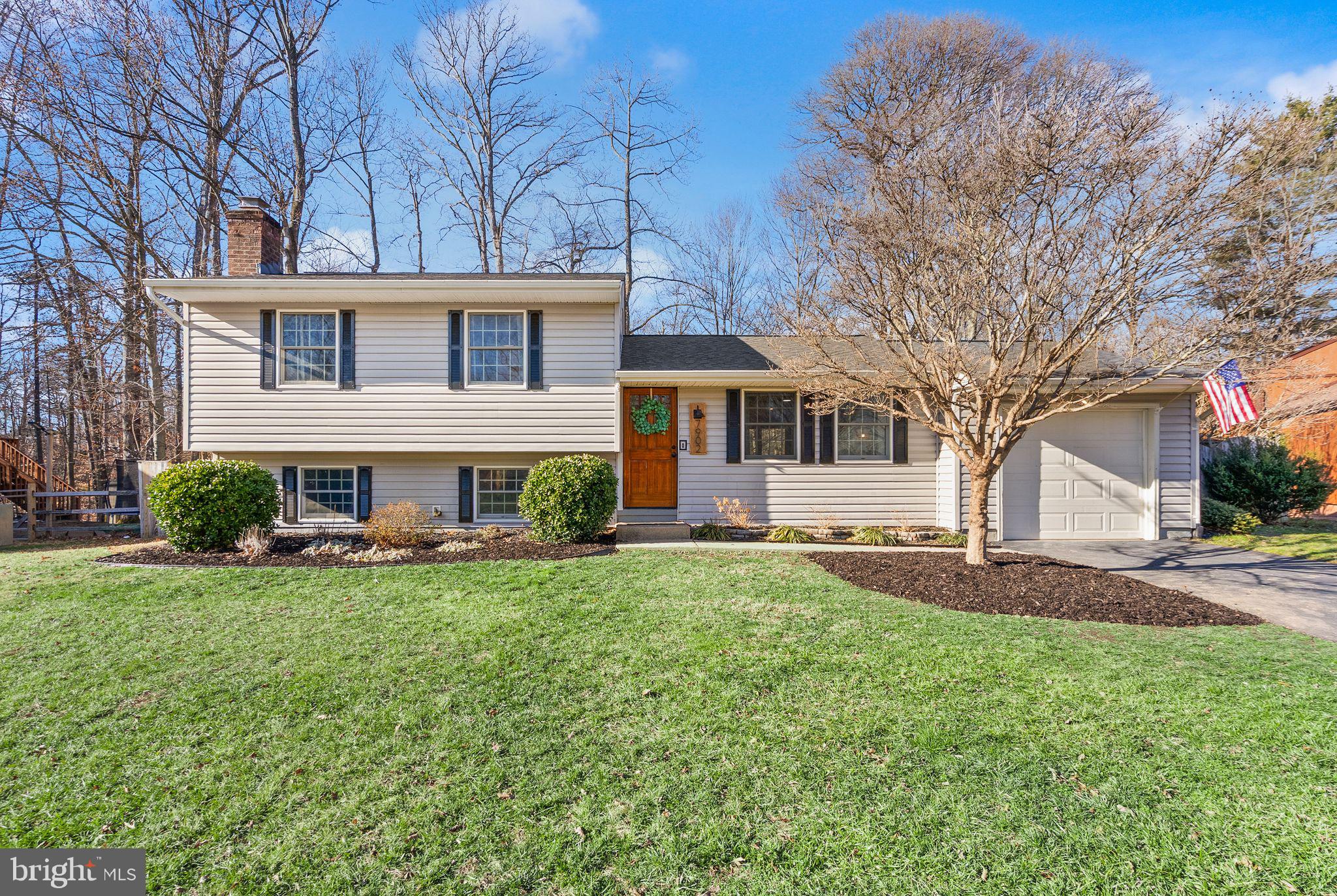 7902 Cliff Rock Court Springfield, VA 22153 - Photo 54 of 57 front view of a house with a yard