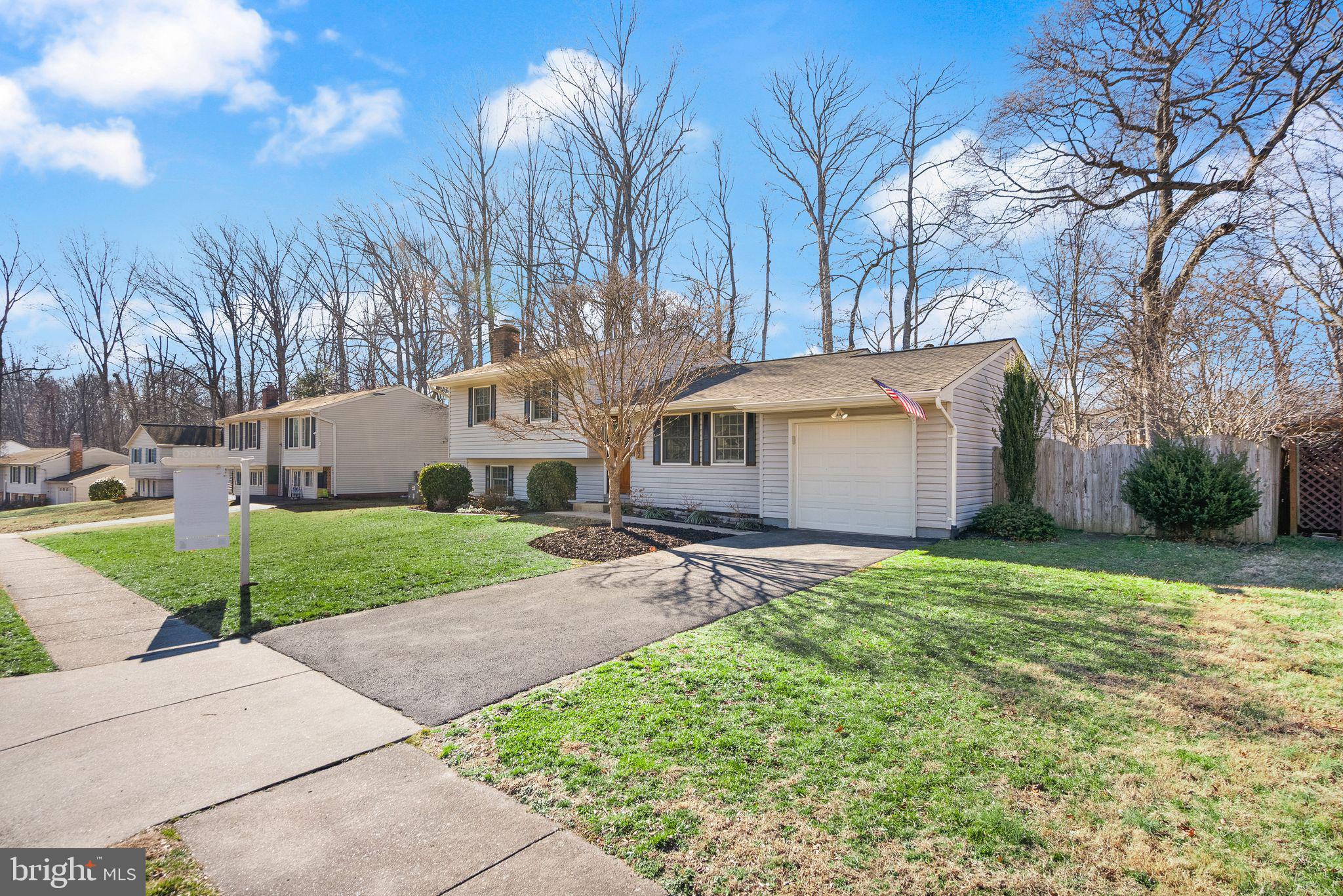 7902 Cliff Rock Court Springfield, VA 22153 - Photo 57 of 57 a view of a house with a yard and pathway