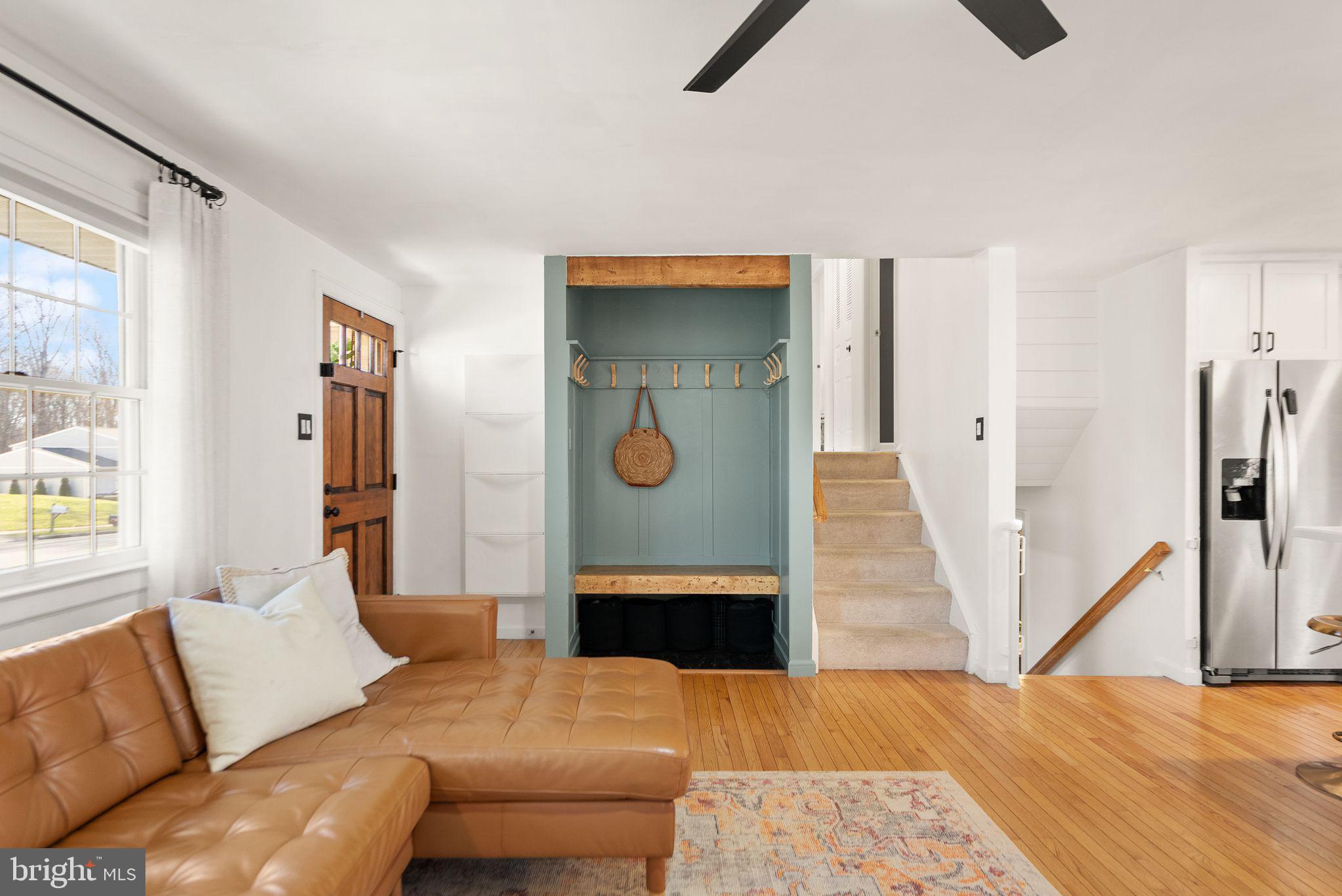 7902 Cliff Rock Court Springfield, VA 22153 - Photo 8 of 57 a living room with furniture and a wooden floor