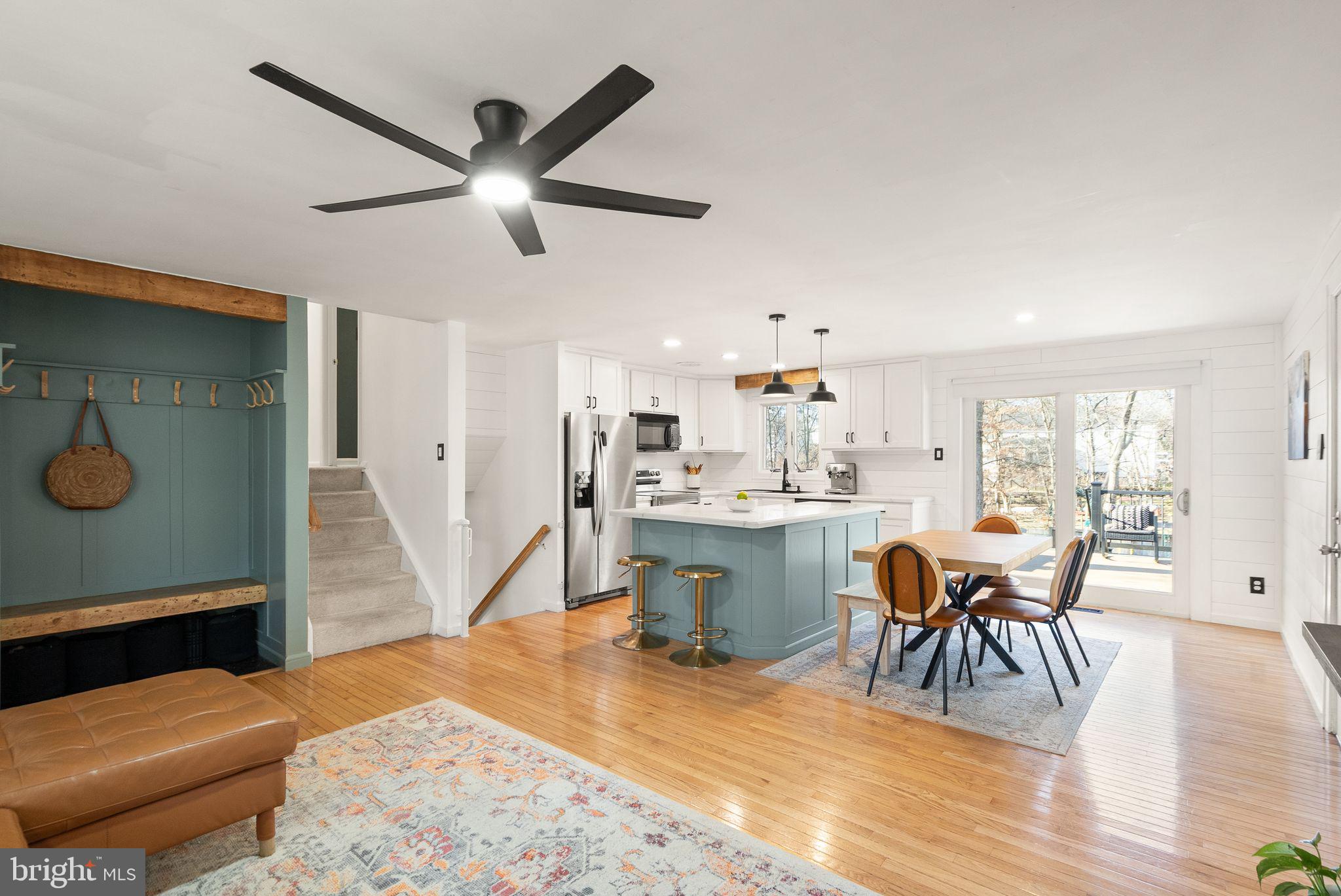 7902 Cliff Rock Court Springfield, VA 22153 - Photo 9 of 57 a dining room with wooden floor and a window